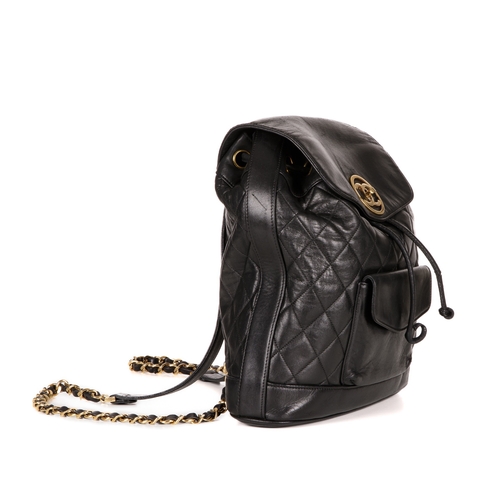 264 - Chanel, a vintage black quilted leather backpack w/pouch, featuring gold-tone hardware, a front patc... 