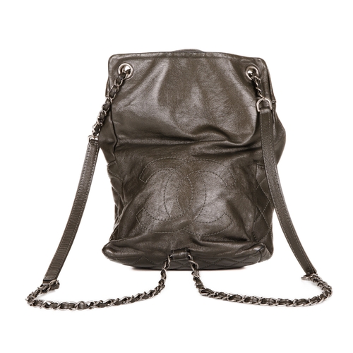 265 - Chanel, a small drawstring backpack, crafted from metallic pewter leather, featuring antiqued silver... 