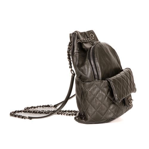 265 - Chanel, a small drawstring backpack, crafted from metallic pewter leather, featuring antiqued silver... 