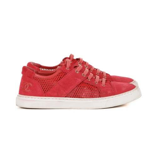 267 - Chanel, a pair of red CC sneakers, featuring suede and mesh uppers and white rubber soles, labelled ... 