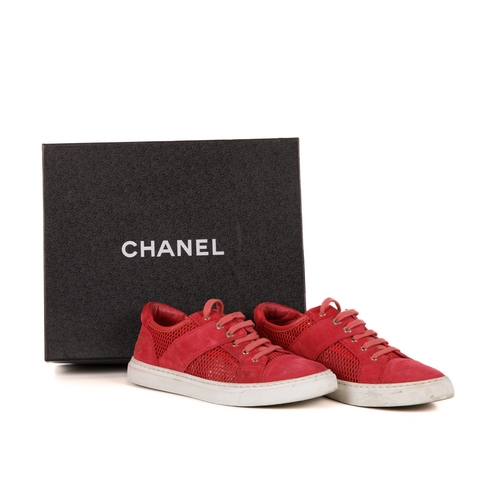 267 - Chanel, a pair of red CC sneakers, featuring suede and mesh uppers and white rubber soles, labelled ... 