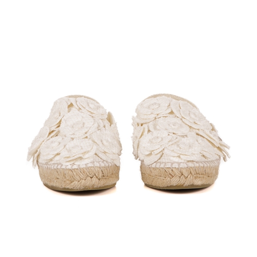 268 - Chanel, a pair of Camellia espadrilles, designed with cream canvas uppers with layered camellia flow... 