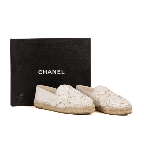 268 - Chanel, a pair of Camellia espadrilles, designed with cream canvas uppers with layered camellia flow... 