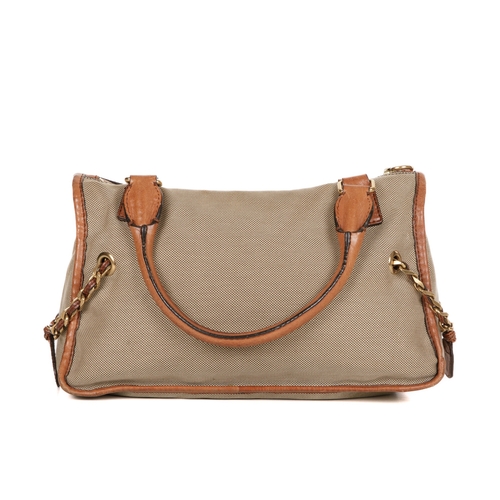 270 - Chloe, a Haley handbag, designed with a khaki canvas exterior with tan leather trim, featuring a fro... 