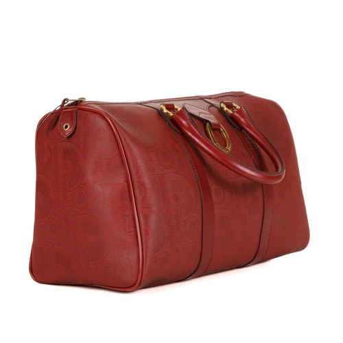 273 - Christian Dior, a red Boston bag, designed with a large Diroissimo patterned coated canvas exterior ... 