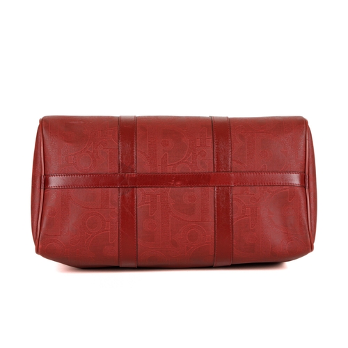 273 - Christian Dior, a red Boston bag, designed with a large Diroissimo patterned coated canvas exterior ... 