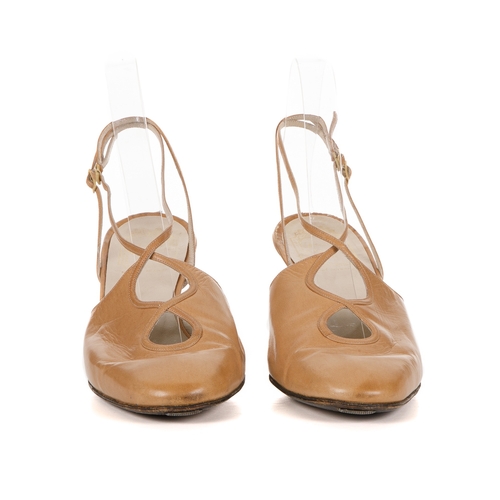 274 - Christian Dior, a pair of vintage shoes, designed with beige leather uppers, cut-out detailing at th... 