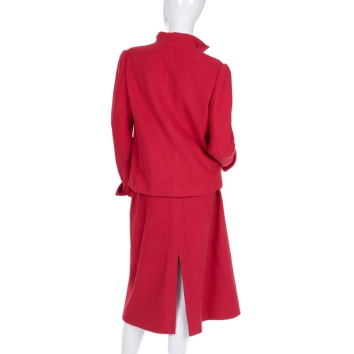 275 - Christian Dior, a red wool skirt suit, comprising a jacket with Mandarin collar, two outer patch poc... 