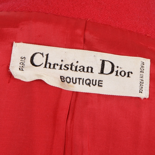 275 - Christian Dior, a red wool skirt suit, comprising a jacket with Mandarin collar, two outer patch poc... 