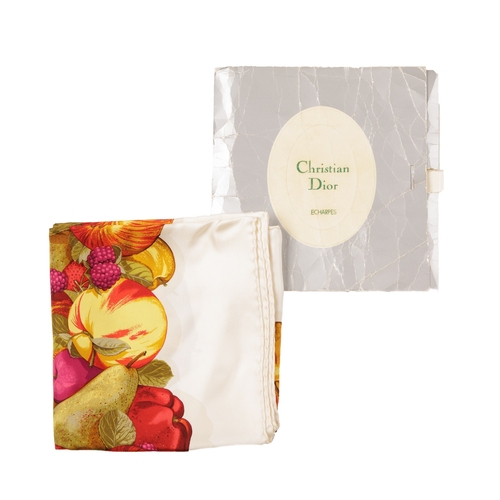 276 - Christian Dior, a silk scarf, featuring a wide border of fruits including apples, pears, plums, rasp... 