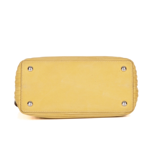 289 - Fendi, a yellow Dotcom handbag, designed with a quilted yellow nubuck leather exterior, silver-tone ... 