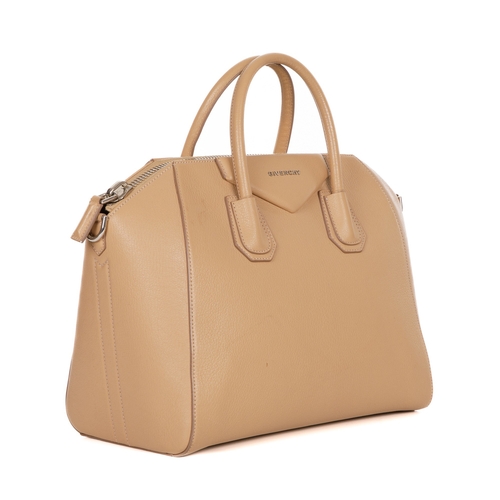 294 - Givenchy, an Antigona handbag, designed with a grained camel leather exterior, with a triangular pat... 