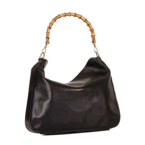 296 - Gucci, a large black leather Bamboo Handle handbag, crafted from smooth black leather, featuring a r... 