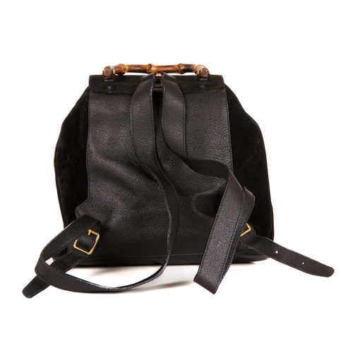 297 - Gucci, a large Bamboo backpack, designed with a black suede exterior with grained leather trim, feat... 