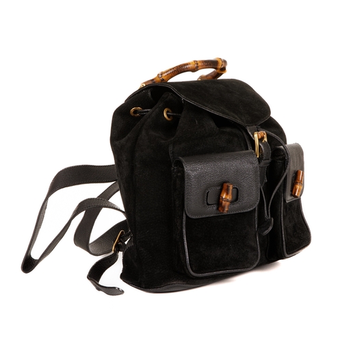 297 - Gucci, a large Bamboo backpack, designed with a black suede exterior with grained leather trim, feat... 