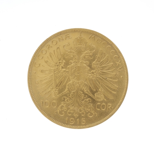 30 - Francis Joseph I, a gold Austrian Empire one hundred corona coin, dated 1915, with Imperial Eagle re... 