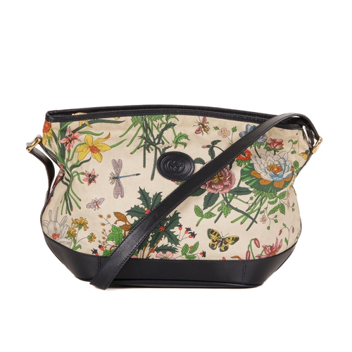 300 - Gucci, a vintage Floral crossbody handbag, designed with a coated canvas exterior with multicoloured... 