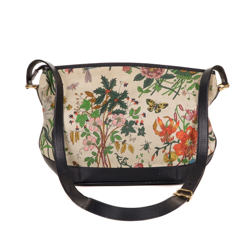 300 - Gucci, a vintage Floral crossbody handbag, designed with a coated canvas exterior with multicoloured... 