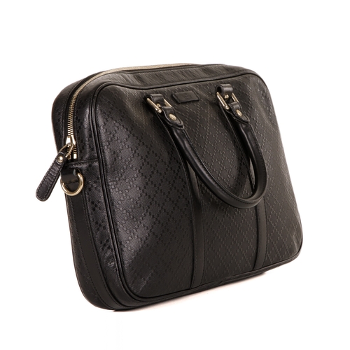 304 - Gucci, a black leather Diamante briefcase, featuring the maker's black leather diamante patterned ex... 