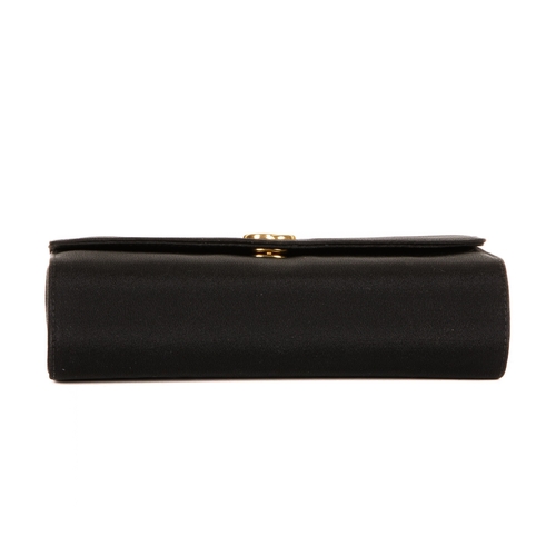 305 - Gucci, a vintage clutch, designed with a structured shape, with a black fabric exterior, gold-tone G... 