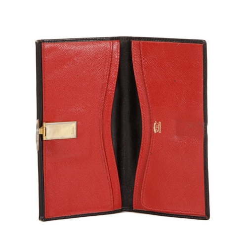 306 - Gucci, a vintage leather wallet, designed with a smooth black leather exterior, featuring a coin com... 