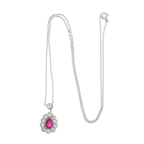 31 - An early 20th century platinum ruby and old-cut diamond cluster pendant, with integral chain, ruby e... 