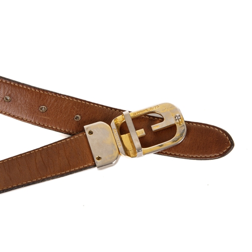 310 - Gucci, a vintage leather belt, crafted from dark brown leather with a stylised GG pin buckle fastene... 