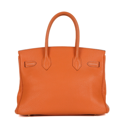 314 - Hermes, a 2004 Birkin 30 handbag, designed with a grained orange leather exterior with gold-plated h... 