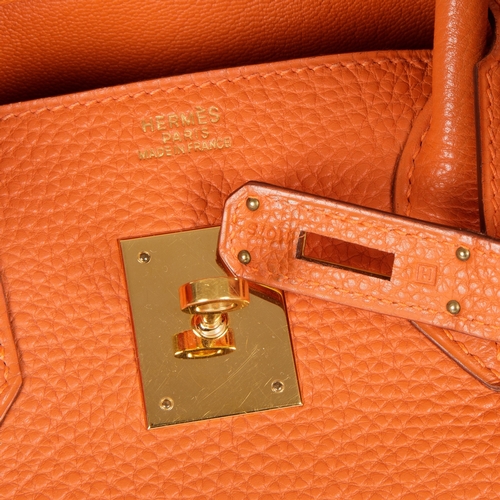 314 - Hermes, a 2004 Birkin 30 handbag, designed with a grained orange leather exterior with gold-plated h... 