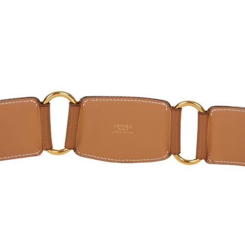 317 - Hermes, a vintage tan Epsom leather belt, featuring gold-tone hoop spacers and a square gold-tone bu... 