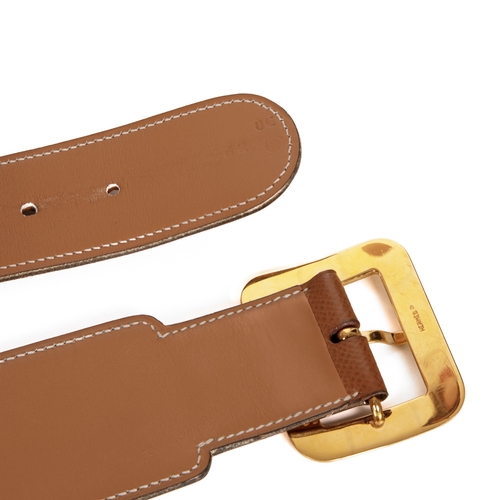 317 - Hermes, a vintage tan Epsom leather belt, featuring gold-tone hoop spacers and a square gold-tone bu... 