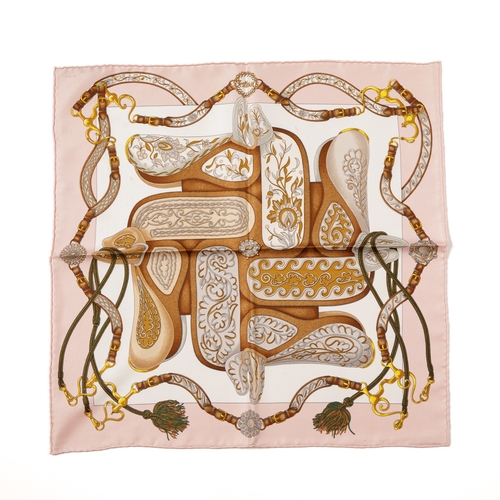 327 - Hermes, a small Festival silk scarf, designed by Henri d'Origny in 1992 and features horse saddles u... 