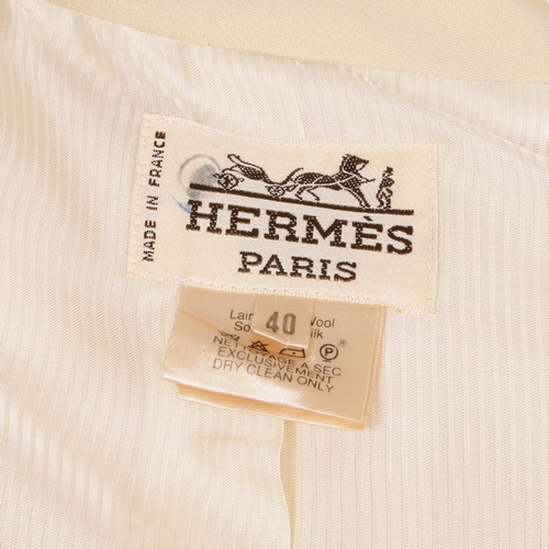 328 - Hermes, a 1980s cream silk/wool blend jacket, featuring front button fastenings and two exterior poc... 