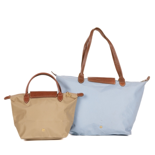 334 - Longchamp, two Le Pliage handbags, to include a large light blue nylon shopping tote, together with ... 