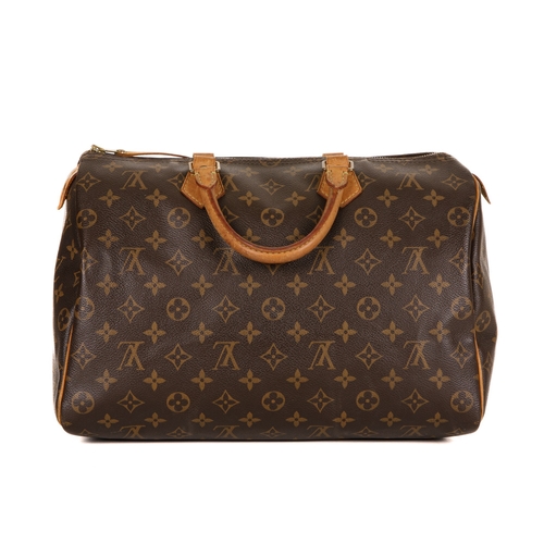 344 - Louis Vuitton, a monogram Speedy 35 handbag, featuring the maker's monogram coated canvas exterior w... 