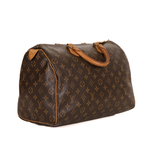 344 - Louis Vuitton, a monogram Speedy 35 handbag, featuring the maker's monogram coated canvas exterior w... 