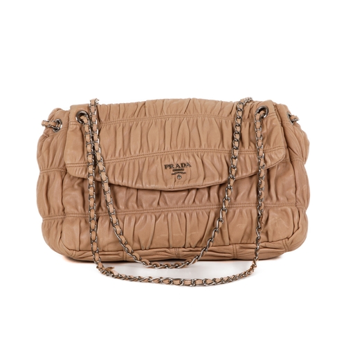 385 - Prada, a Gaufre leather handbag, featuring a gathered beige leather exterior with polished silver-to... 