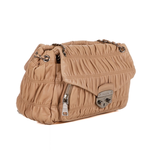 385 - Prada, a Gaufre leather handbag, featuring a gathered beige leather exterior with polished silver-to... 