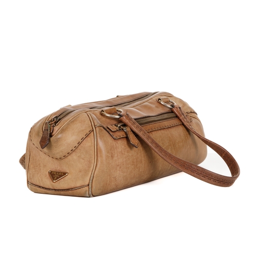 389 - Prada, a leather handbag and matching purse, crafted from smooth beige leather, with two exterior zi... 