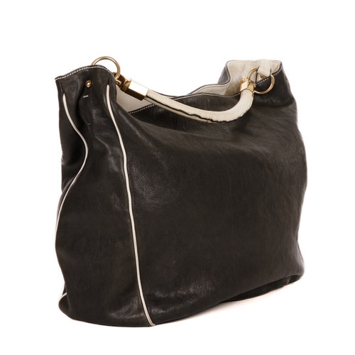 409 - Yves Saint Laurent, a large Roady hobo handbag, crafted from black leather with contrasting white le... 