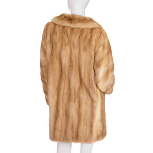 441 - A three-quarter length pastel mink coat, featuring a notched lapel collar, hook and eye fastenings, ... 