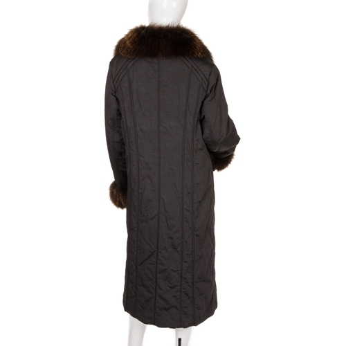 445 - A full-length black coat with fox fur trim, featuring a black polyester/cotton shell, with brushed g... 