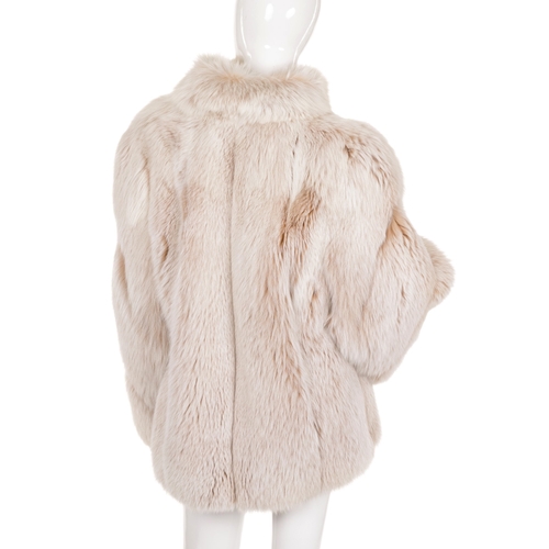 446 - A blush fox fur coat, featuring a short Mandarin collar, hook and eye clip fastenings and two outer ... 