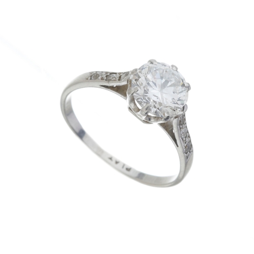 60 - A mid 20th century platinum circular-shape diamond single-stone ring, with old-cut diamond line shou... 