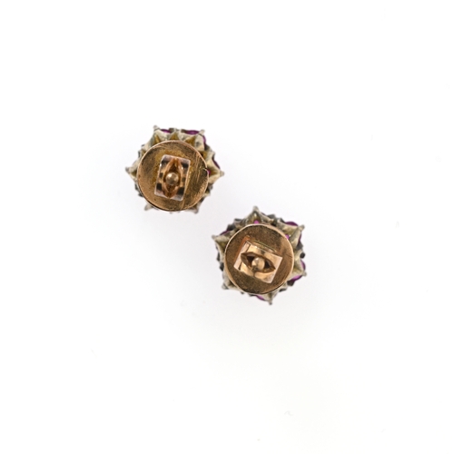 66 - A pair of early 20th century gold ruby and brilliant-cut diamond cluster stud earrings, estimated to... 