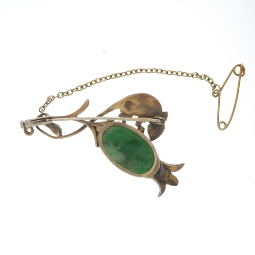 81 - An 18ct gold jadeite brooch, modelled as a field mouse on a seed pod, with onyx eye detail, stamped ... 