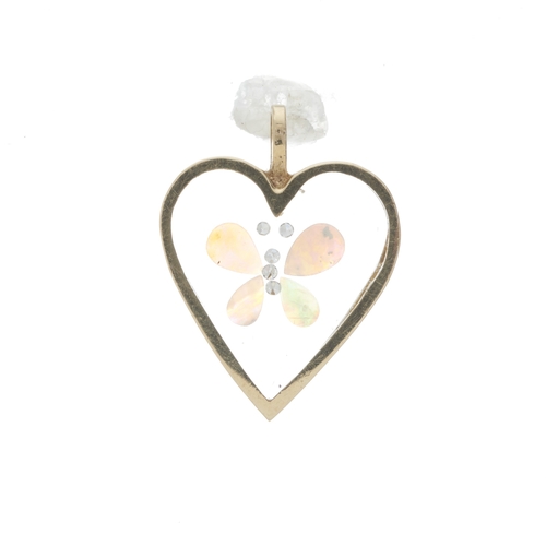 83 - A gold heart-shape glazed pendant, with encapsulated opals and single-cut diamonds to form a butterf... 