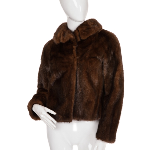 453 - A ranch mink jacket, featuring a notched lapel collar, hook and eye clip fastenings, and one interio... 