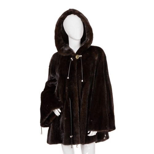 448 - A ranch mink hooded swing coat, designed with a large fur-lined hood with black leather drawcords an... 