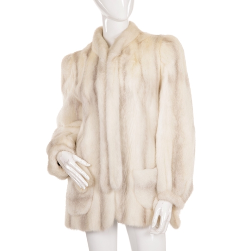 446 - A blush fox fur coat, featuring a short Mandarin collar, hook and eye clip fastenings and two outer ... 